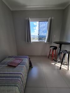 Ένα ή περισσότερα κρεβάτια σε δωμάτιο στο Quartos com banheiro na cidade do Cristo