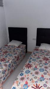 Posteľ alebo postele v izbe v ubytovaní Apartamentos Tierra de Irta 3000