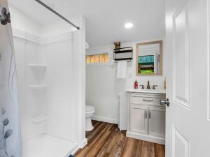 a bathroom with a toilet and a sink at Romantic King-Bed Couples Cabin Lake Lure in Lake Lure