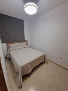Postel nebo postele na pokoji v ubytování Marina de El Morche