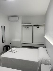 Postel nebo postele na pokoji v ubytování Hotel DL Urban