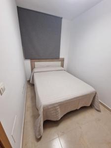 Postel nebo postele na pokoji v ubytování Marina de El Morche