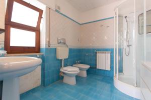 a bathroom with a sink and a toilet and a tub at Villa Mondello in Mondello +19 photos