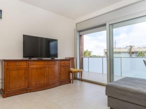 Μια τηλεόραση ή/και κέντρο ψυχαγωγίας στο Apartment Aquaria-6 by Interhome