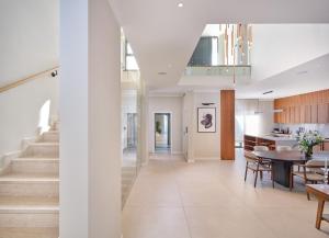 a dining room and kitchen with a dining table at Seaside Villa by Brown Hotels in Trogir