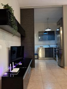a kitchen with a desk with a computer on it at Apartamento Ataraxia in Ronda