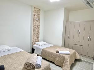 Ένα ή περισσότερα κρεβάτια σε δωμάτιο στο Hogar acogedor con un toque navideño