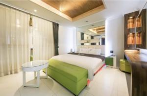 Postel nebo postele na pokoji v ubytování Hotel Zara Gwangju Cheomdan