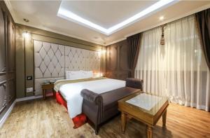 Postel nebo postele na pokoji v ubytování Hotel Zara Gwangju Cheomdan