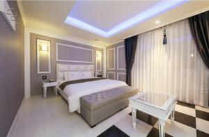 Postel nebo postele na pokoji v ubytování Hotel Zara Gwangju Cheomdan