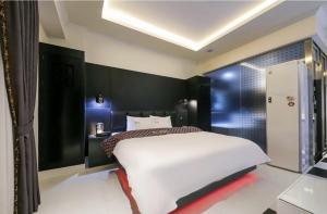 Postel nebo postele na pokoji v ubytování Hotel Zara Gwangju Cheomdan