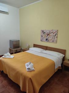 Postel nebo postele na pokoji v ubytování Piccolo Hotel Nuova gestione