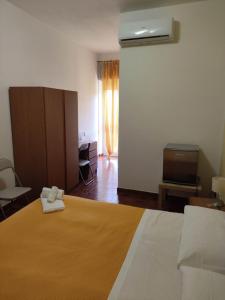 Postel nebo postele na pokoji v ubytování Piccolo Hotel Nuova gestione