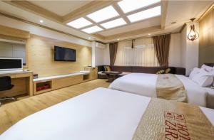 TV a/nebo společenská místnost v ubytování Hotel Zara Gwangju Cheomdan