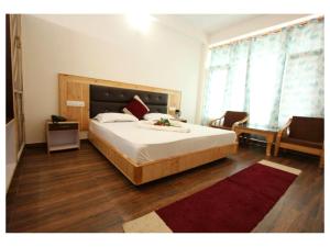 Postel nebo postele na pokoji v ubytování Hotel Saras Manali