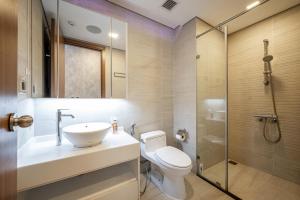 a bathroom with a toilet and a sink and a shower at Saigon Landmark Cityview Apartment - PYG in Ho Chi Minh City +56 photos