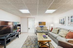 a living room with a couch and a tv at Herons Watch in Bumpass
