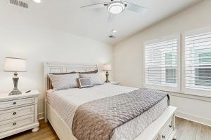 a bedroom with a bed and a ceiling fan at Oyster House Village --- 21503 Helm St in Rehoboth Beach +23 photos