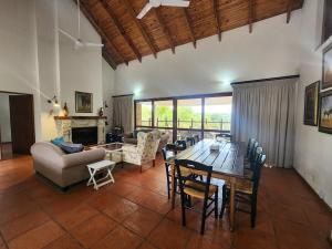 a large living room with a table and chairs at Golf Estate Vacation Property - Poseidon's Knoll in White River