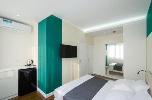 Voodi või voodid majutusasutuse Latorre Hotel toas