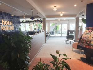 a lobby of a hotel with plants in it at Best Western Kobalt Annecy Nord - Epagny in Épagny