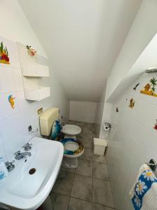 Koupelna v ubytování Carol Home