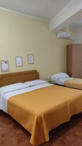 Postel nebo postele na pokoji v ubytování Piccolo Hotel Nuova gestione