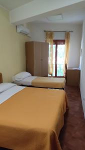 Postel nebo postele na pokoji v ubytování Piccolo Hotel Nuova gestione