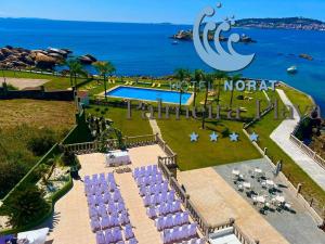 an aerial view of a resort with a swimming pool at Hotel Norat Palmeira Playa in Ribeira