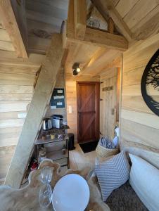 a room with a staircase in a wooden cabin at La ferme de Basseilles in Mozet 