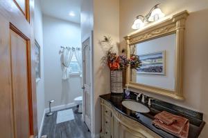 a bathroom with a sink and a mirror at Panoramic View Canyon Lake Home in Canyon Lake +17 photos