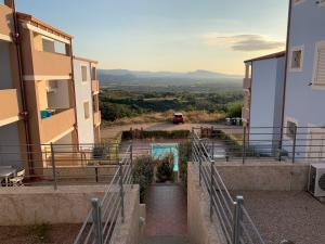 a set of stairs leading up to a building at Affaccio sul Golfo dell'Asinara in Badesi
