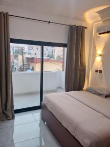 Voodi või voodid majutusasutuse Appartement lampakou toas