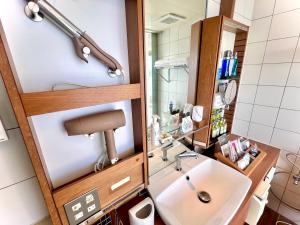 a bathroom with a sink and a mirror at Hotel Aligator -Adult Only- in Hatsukaichi +24 photos
