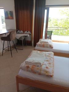 Postel nebo postele na pokoji v ubytování Rooms & Apartment Hegic