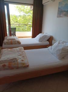 Postel nebo postele na pokoji v ubytování Rooms & Apartment Hegic