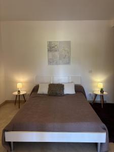 Ένα ή περισσότερα κρεβάτια σε δωμάτιο στο Appartement Romana PUISSALICON 34