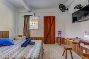 Cama ou camas em um quarto em Pousada Residenzial Cariocare