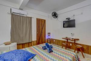 Cama ou camas em um quarto em Pousada Residenzial Cariocare