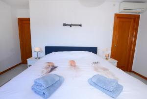 Łóżko lub łóżka w pokoju w obiekcie Calpe place