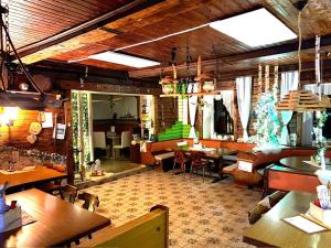 a restaurant with tables and chairs in a room at Gasthof Wölger in Admont