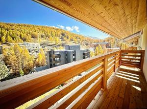 a balcony with a view of a city at AO Duplex 82 m2 in Vars