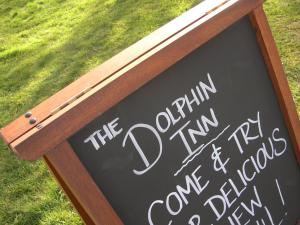 a chalkboard sign that says the opinion inn and wedding dances at The Dolphin Inn in Thorpeness