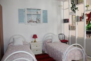 Postel nebo postele na pokoji v ubytování B&B Flower House