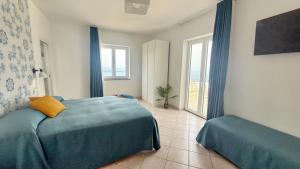 Postel nebo postele na pokoji v ubytování Villa Raf