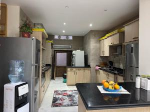 a kitchen with a bowl of fruit on a counter at Villa 348 Jamaran - Sahl Hasheesh in Hurghada