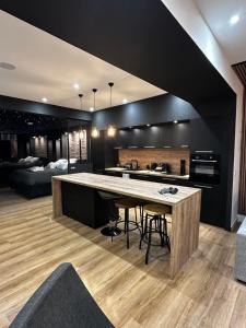 a kitchen with a large table in a room at loft room38 in Voreppe