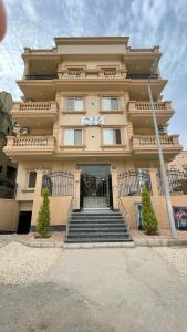 a large building with stairs in front of it at Zayed Plaza-زايد بلازا in Cairo