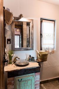 a bathroom with a sink and a mirror at Вила Китна in Lozno