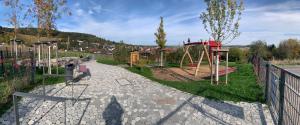 a playground with a swing set in a park at Casa Riebold in Weil der Stadt